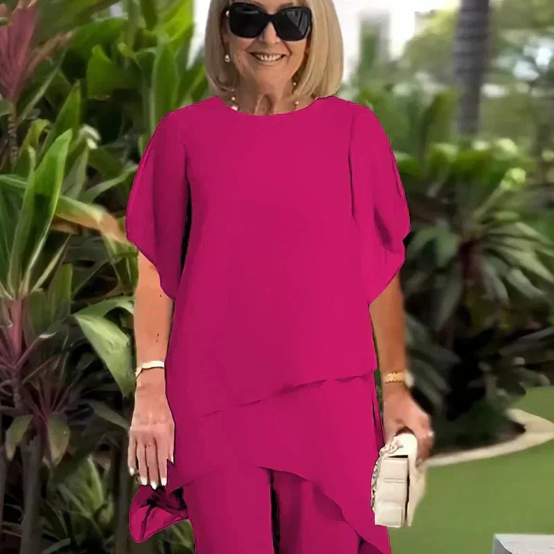 Kostým s drapovanými palazzo kalhotami